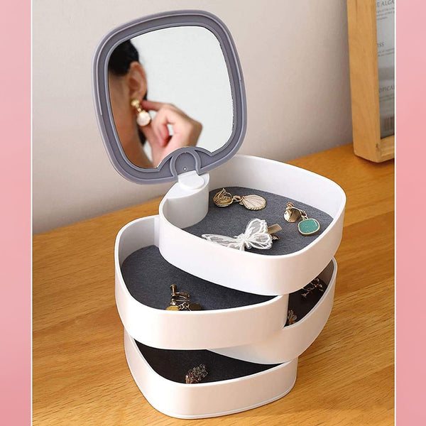 Top view of rotating jewelry box with 4 layers and mirror